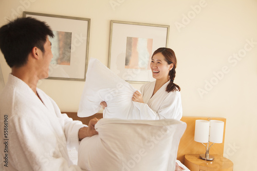 Young Couple Having a Pillow Fight