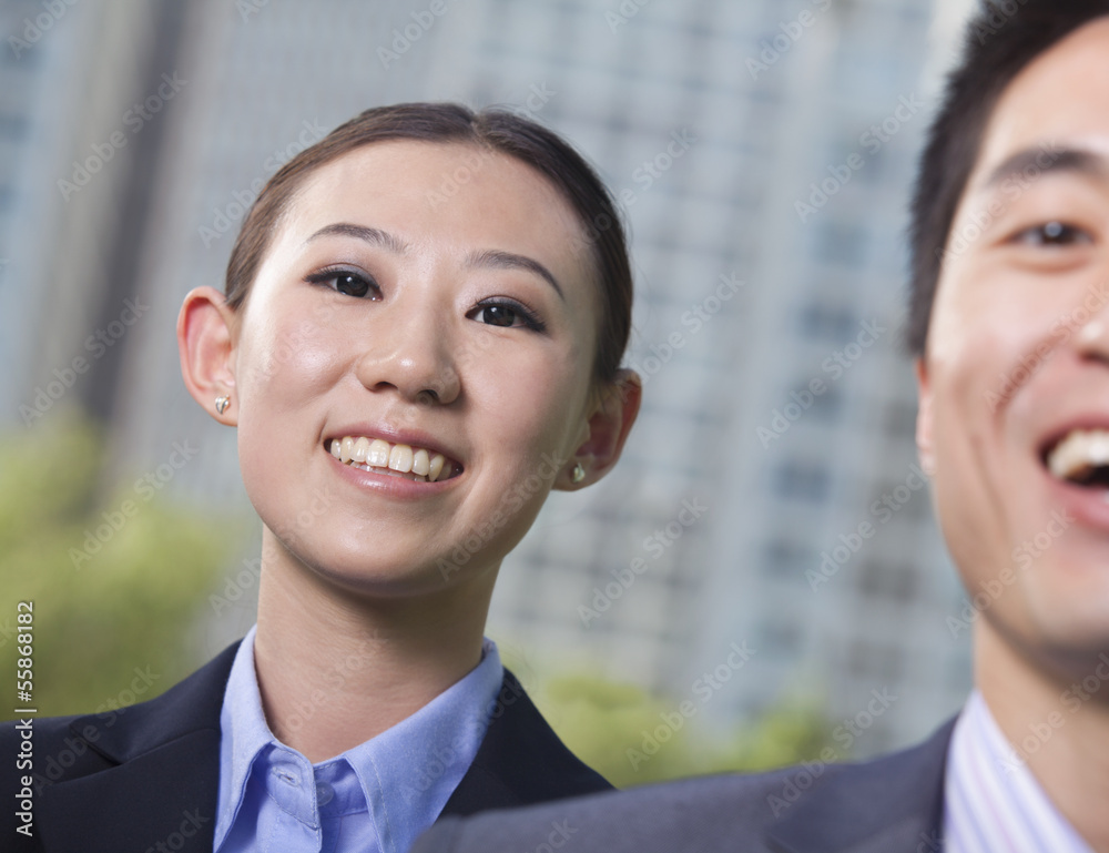Portrait of two young business people outside in the business district, Beijing Portrait of two young business people outside in the business district, Beijing