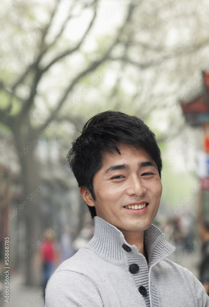 Young Man smiling and looking at camera Young Man smiling and looking at camera