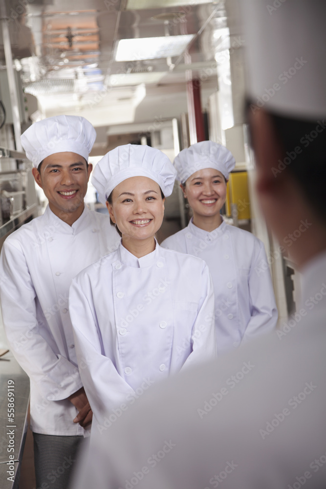 Head Chef Speaking to Assistants