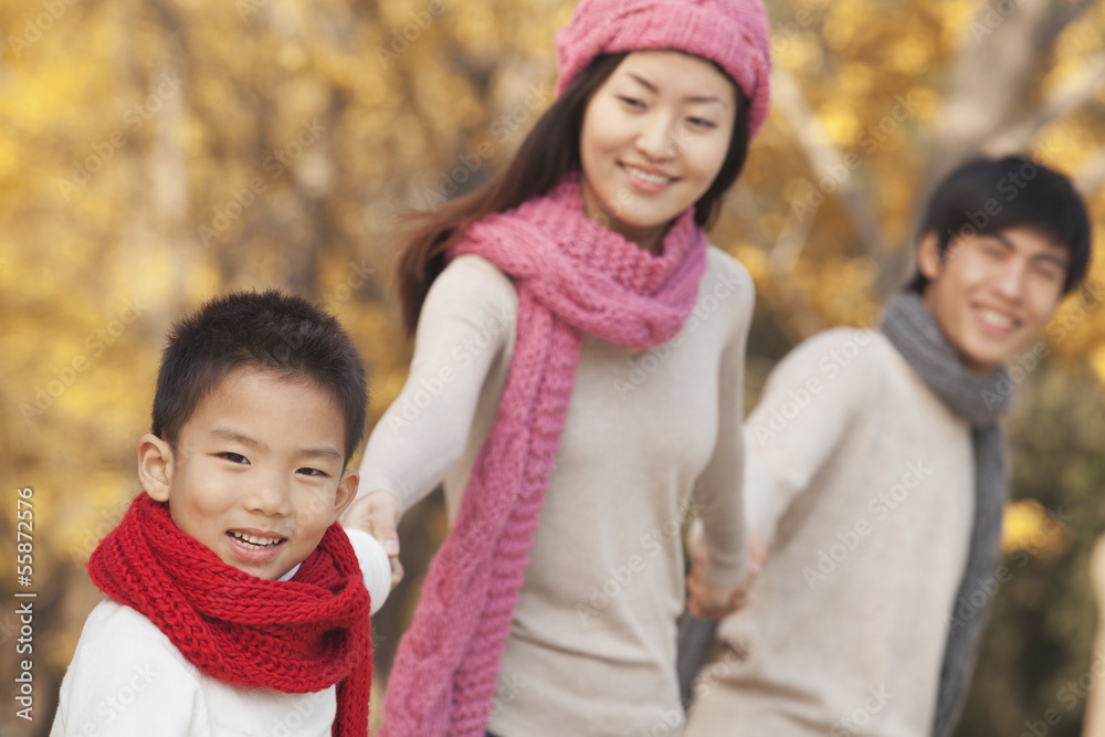 Happy Family in the Park in Autumn Happy Family in the Park in Autumn