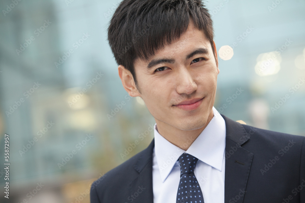 Close-up portrait of confident young businessman, China Close-up portrait of confident young businessman, China