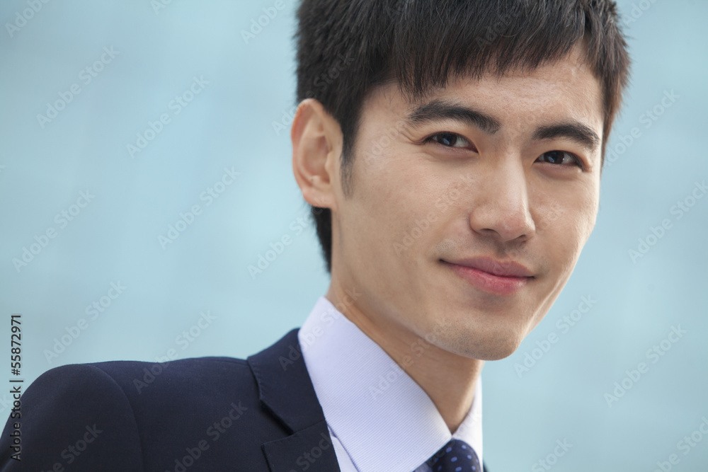 Close-up portrait of young businessman, China Close-up portrait of young businessman, China