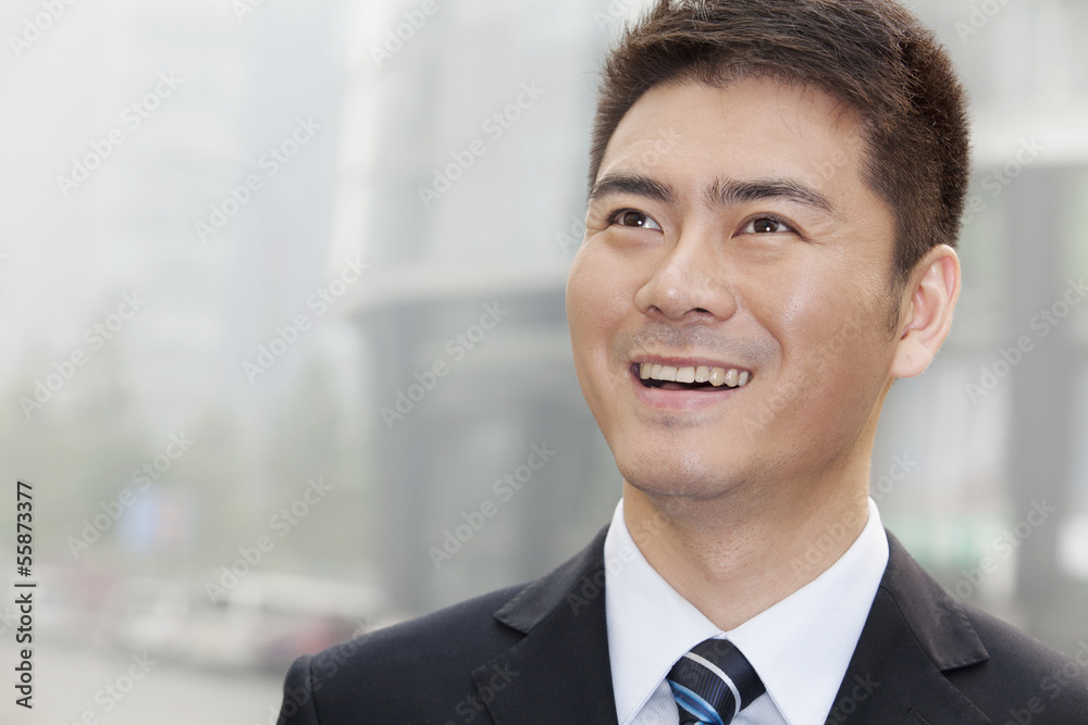 Young Businessman Smiling and Looking Away, Portrait Young Businessman Smiling and Looking Away, Portrait