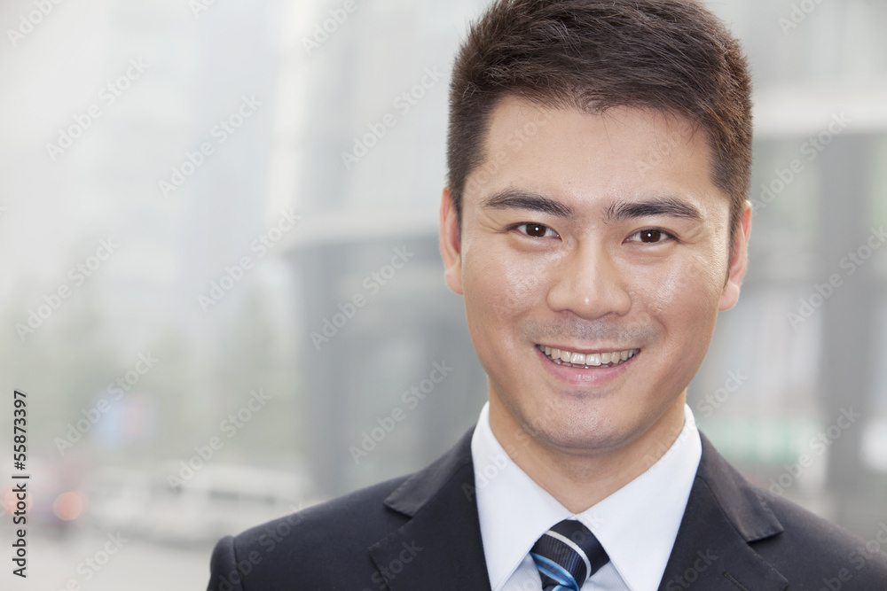 Young Businessman Smiling and Looking into Camera, Portrait Young Businessman Smiling and Looking into Camera, Portrait