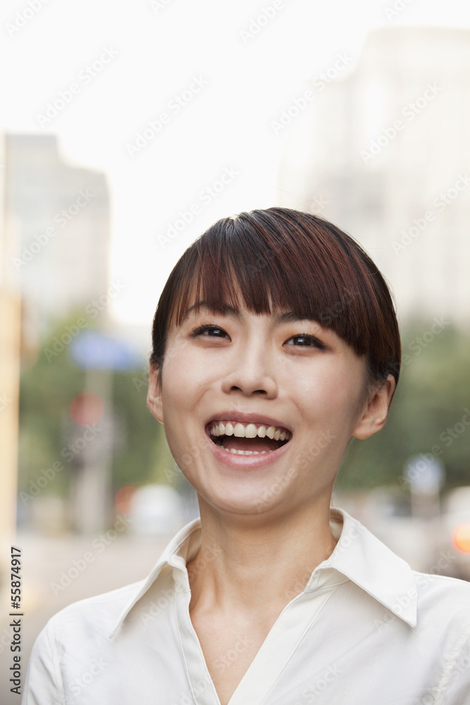 Portrait of young businesswoman laughing outside in Beijing Portrait of young businesswoman laughing outside in Beijing