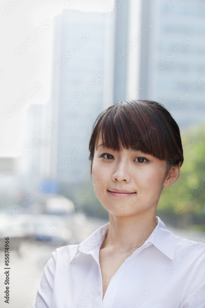 Portrait of young businesswoman smiling, Beijing Portrait of young businesswoman smiling, Beijing