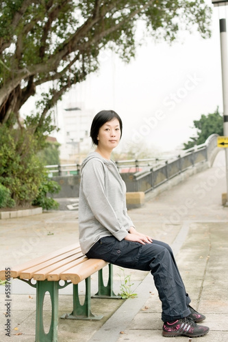 woman sit on bench