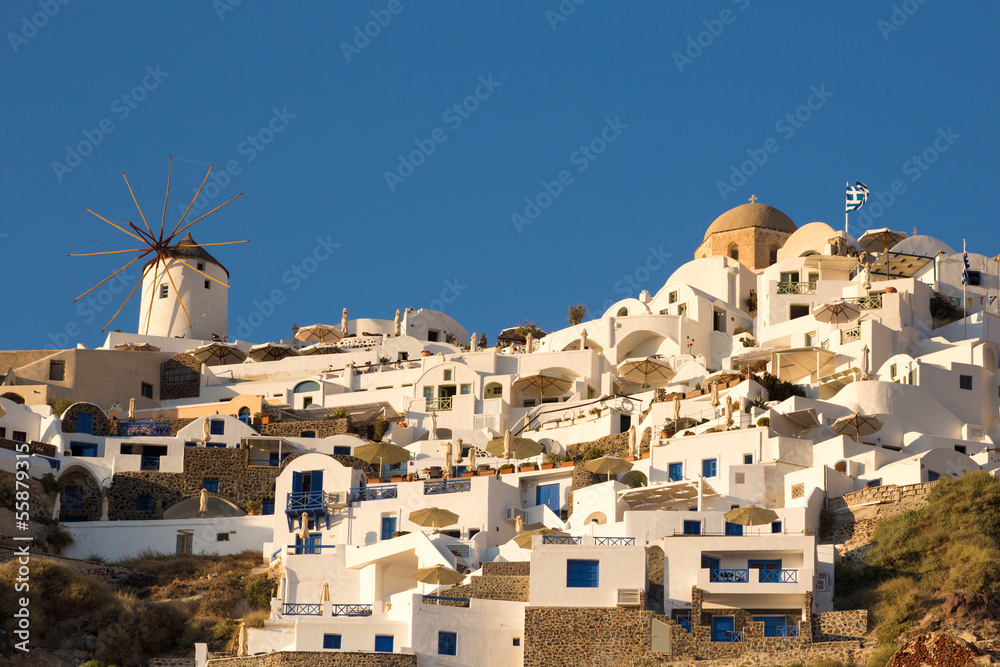 Windmill and different hotels at Oia