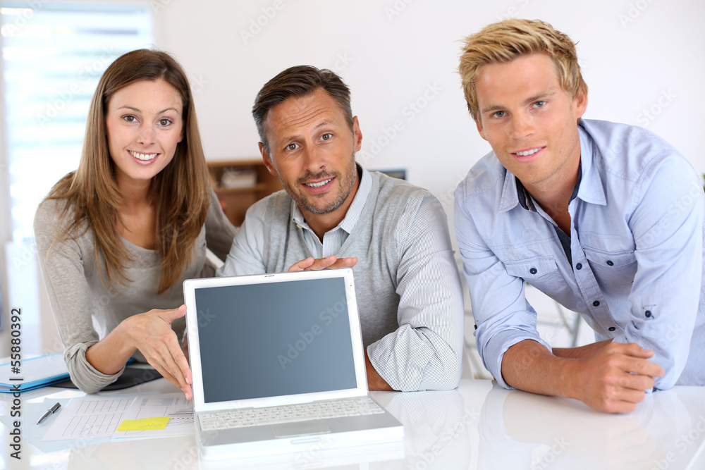 Successful business team showing company results Successful business team showing company results