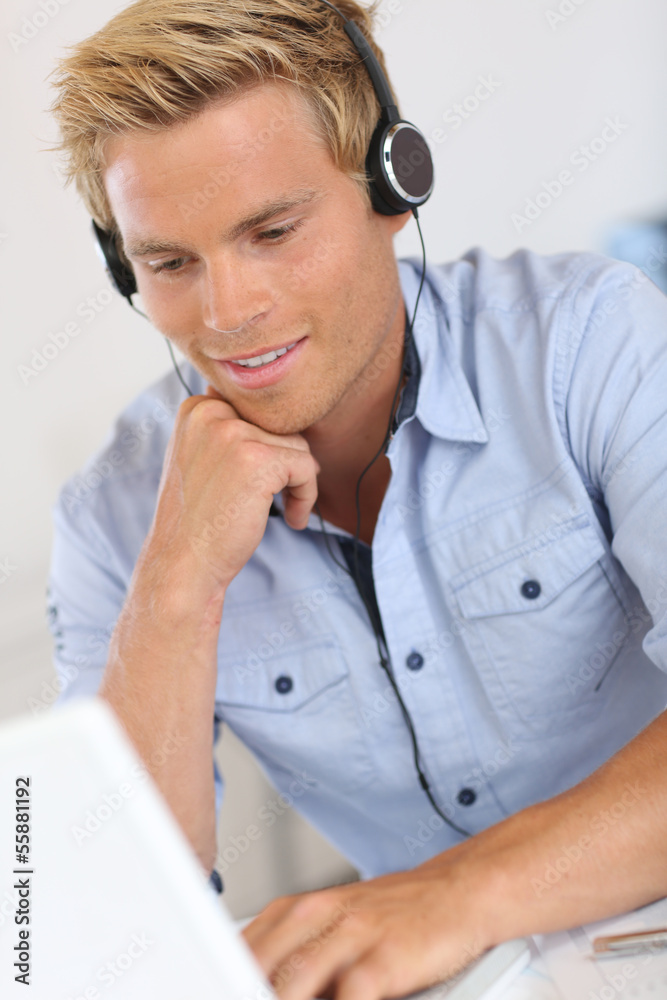 Salesman with headset in conference call Salesman with headset in conference call