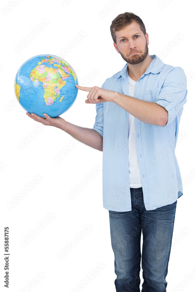 Charming model holding a globe on right hand Charming model holding a globe on right hand