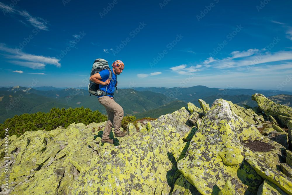 Hiker makes his way in Carpathian mountains