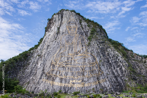 Carved buddha image on the cliff at Khao Chee Jan, Pattaya, Thai