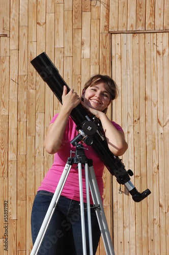 Teen girl and telescope, Near Kiev,Ukraine photo