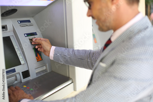 Man withdrawing money from ATM machine