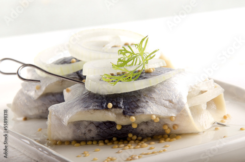onion rings on pickled herring