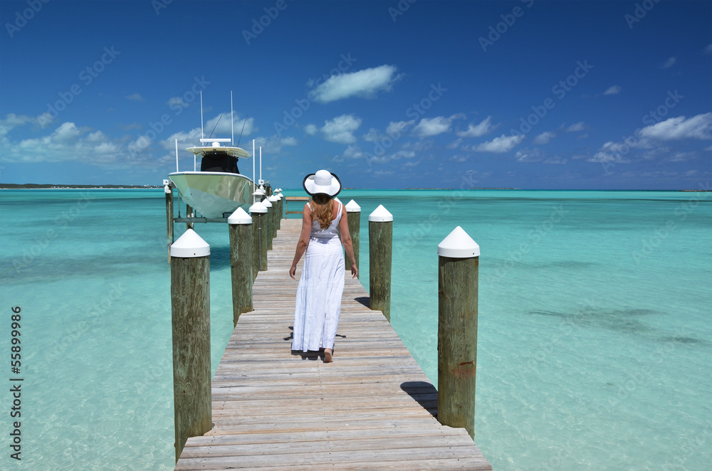 Girl on the wooden jetty. Great Exuma, Bahamas Girl on the wooden jetty. Great Exuma, Bahamas