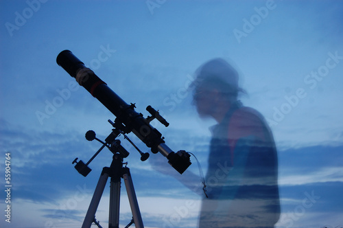 Adult man and telescope with camera.Near Kiev,Ukraine photo