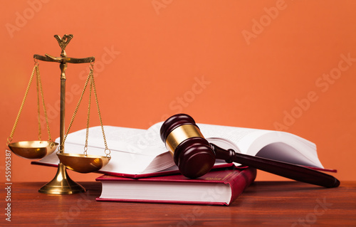 judge gavel,books and scales of justice on table