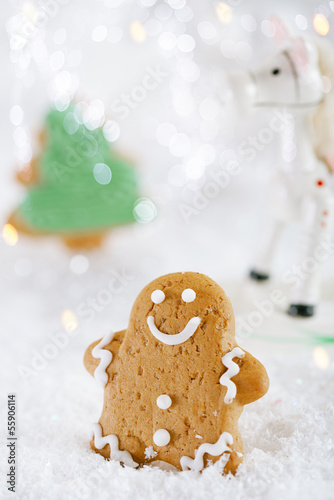 Gingerbread man and tree on a festive Christmas snow background