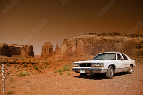 Classic car in the desert of Monument valley