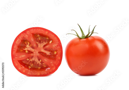 Fresh tomato and half.