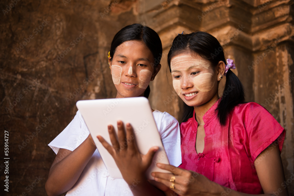 Myanmar girl using digital tablet pc Myanmar girl using digital tablet pc