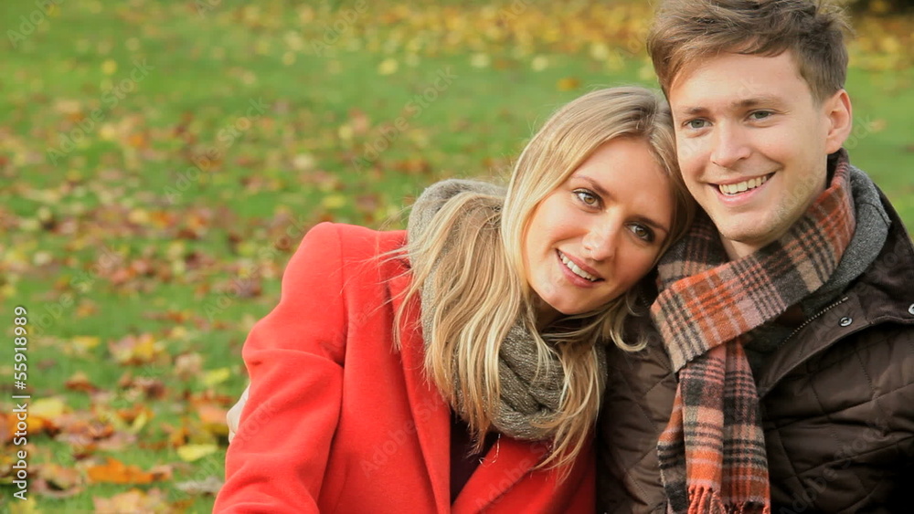 Loving couple in the park Autumn Loving couple in the park Autumn