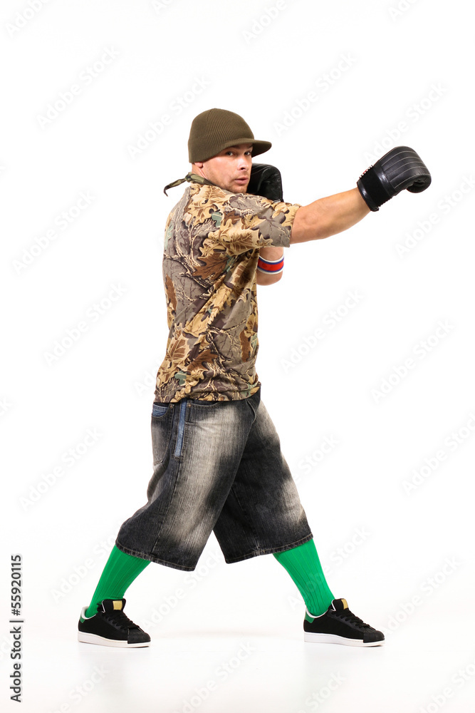 Man in boxing gloves performing hip hop dancing steps Man in boxing gloves performing hip hop dancing steps