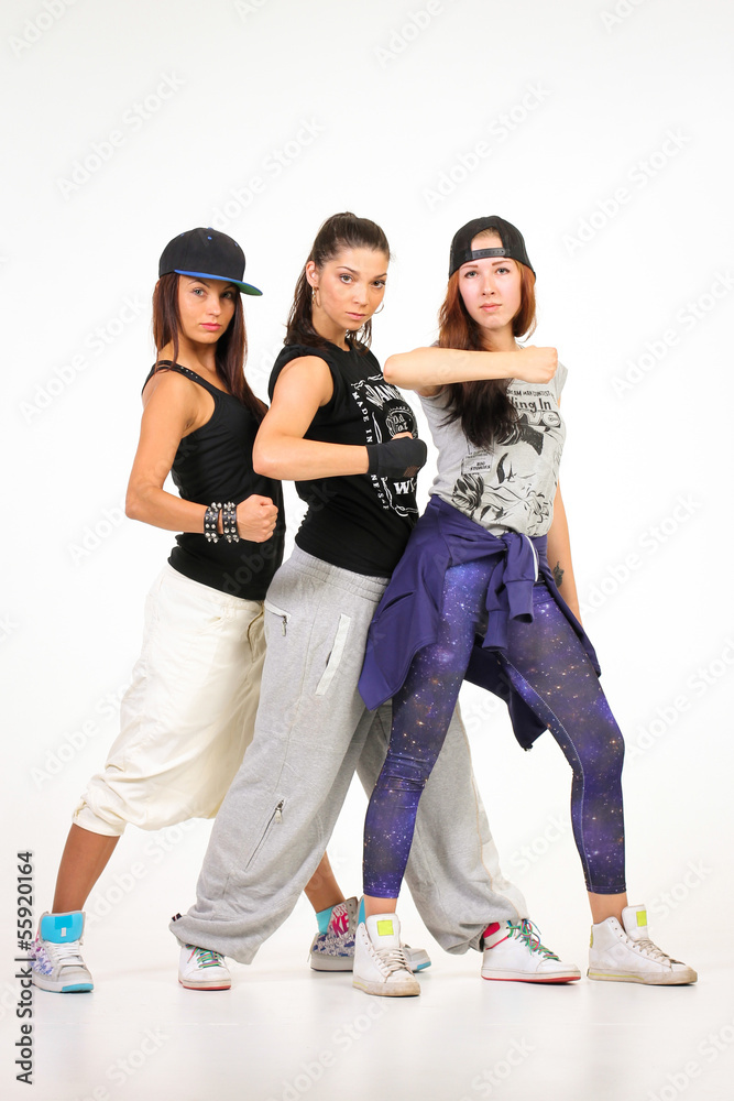 Three confident females in hip hop outfits Stock Photo