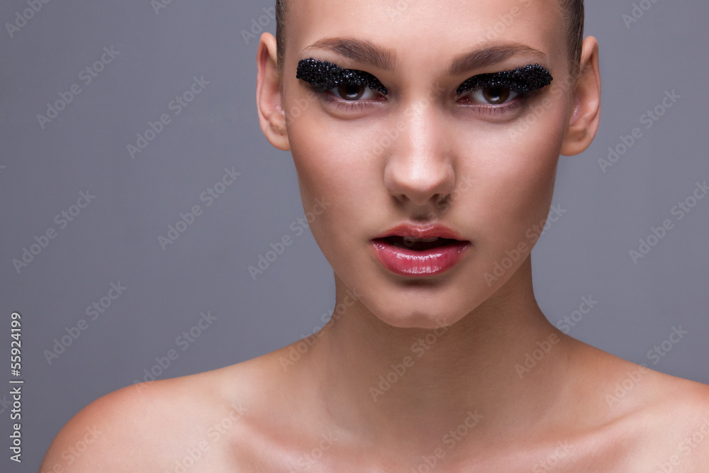 Closeup of perfect fashionable model with creative makeup Closeup of perfect fashionable model with creative makeup