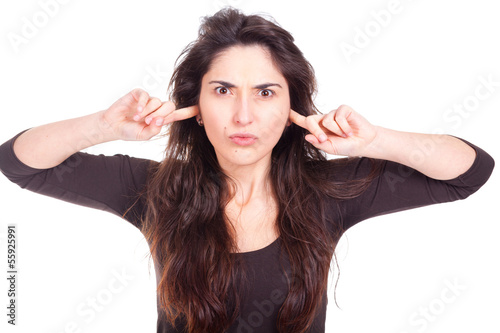 young woman covers her ears