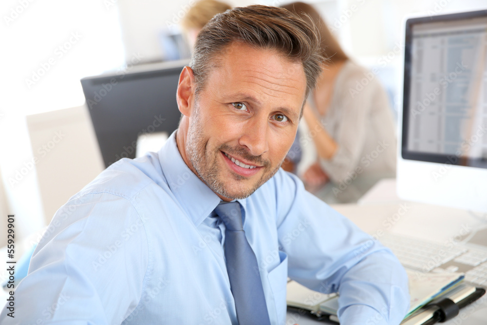 Fototapeta premium Handsome businessman sitting in office
