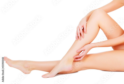 Female legs and hands, white background