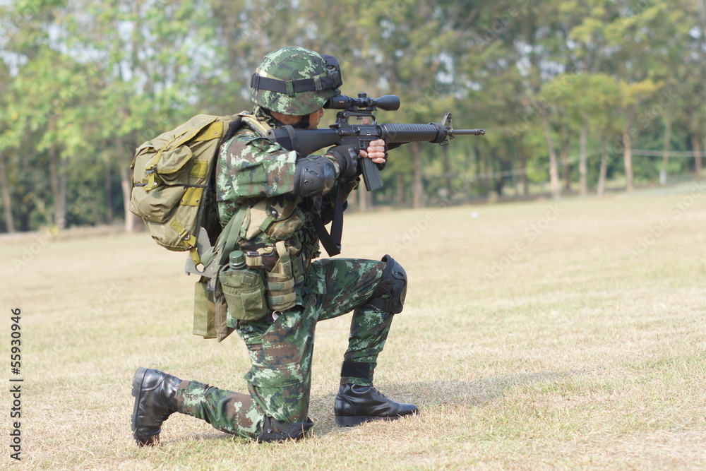 Fototapeta premium Soldier with rifle