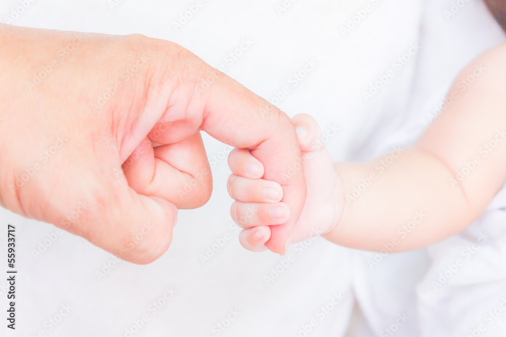 baby hand holding adult finger baby hand holding adult finger