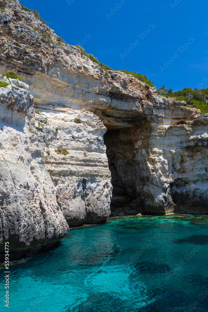 Pirate coast cliff cave at Menorca island, Spain.