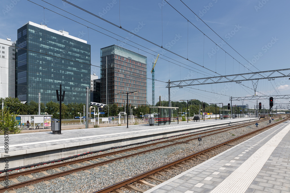 Fototapeta premium Railway station with office buildings in Amsterdam