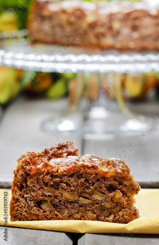 Pieces of nut cake on wooden table.