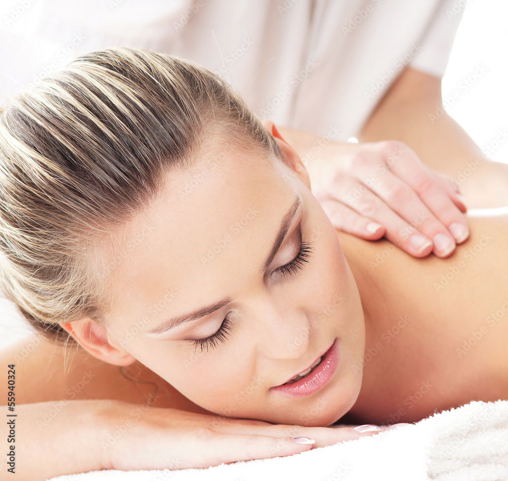 Portrait of a young blond woman relaxing on a massage