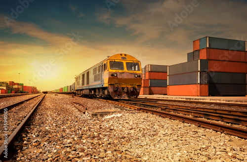 Cargo train platform at sunset with container photo