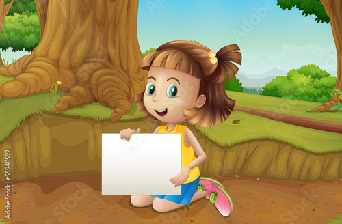 A smiling girl sitting at the ground holding an empty signage