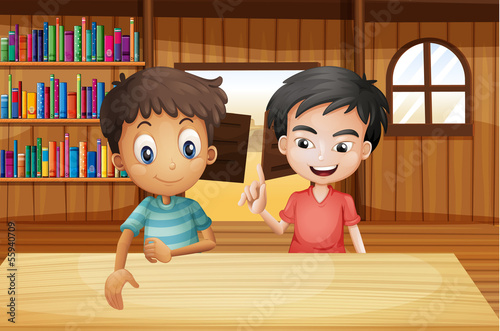 Two boys inside the saloon bar with books