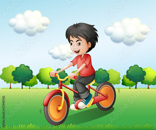 A happy young man biking