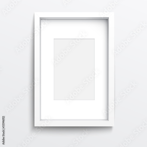 White  vertical frame on gray wall.