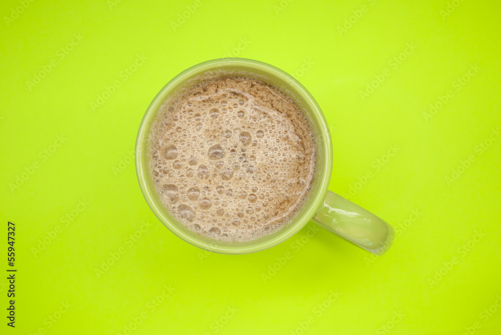 Cup of fresh coffee on a green background Cup of fresh coffee on a green background