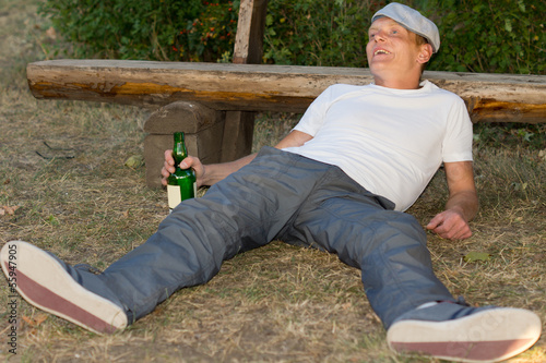 Drunk man experiencing euphoria in the park photo