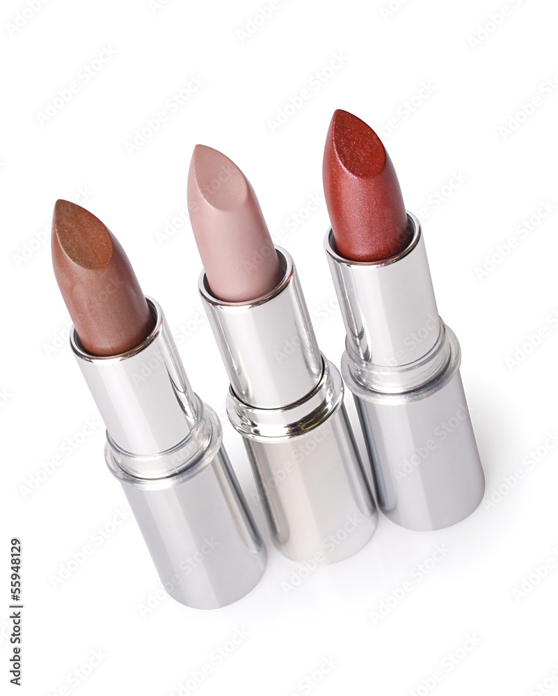 three lipsticks on a white background three lipsticks on a white background