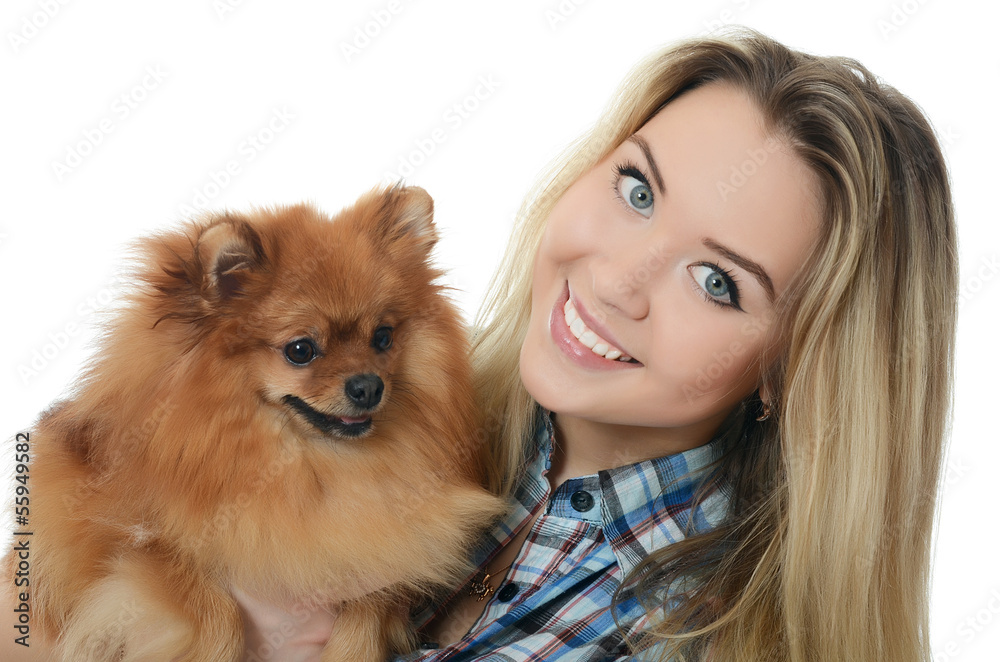 The beautiful girl with a puppy spitz The beautiful girl with a puppy spitz